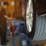 technician is inflate car tire car maintenance service transportation safety