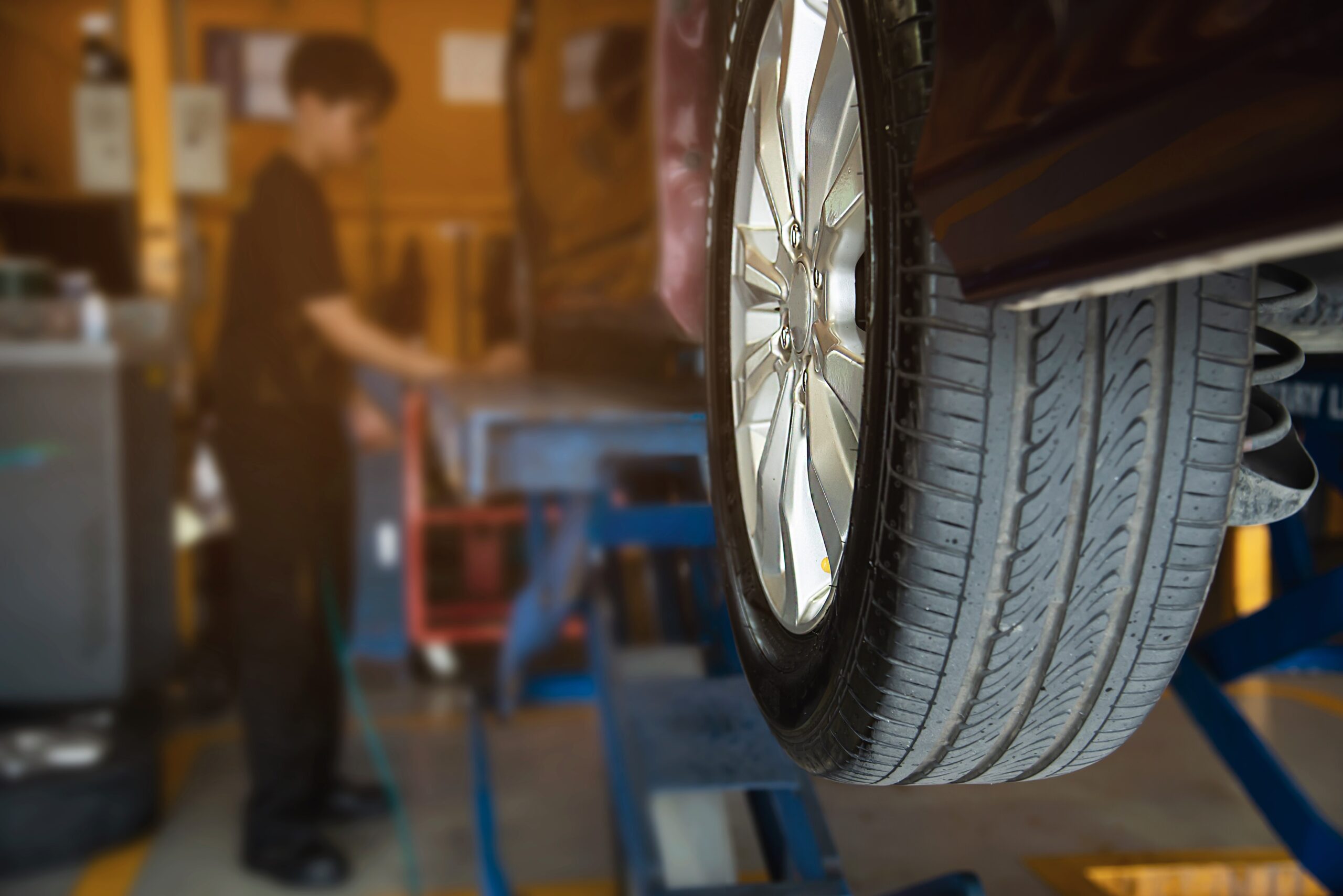 technician is inflate car tire car maintenance service transportation safety scaled